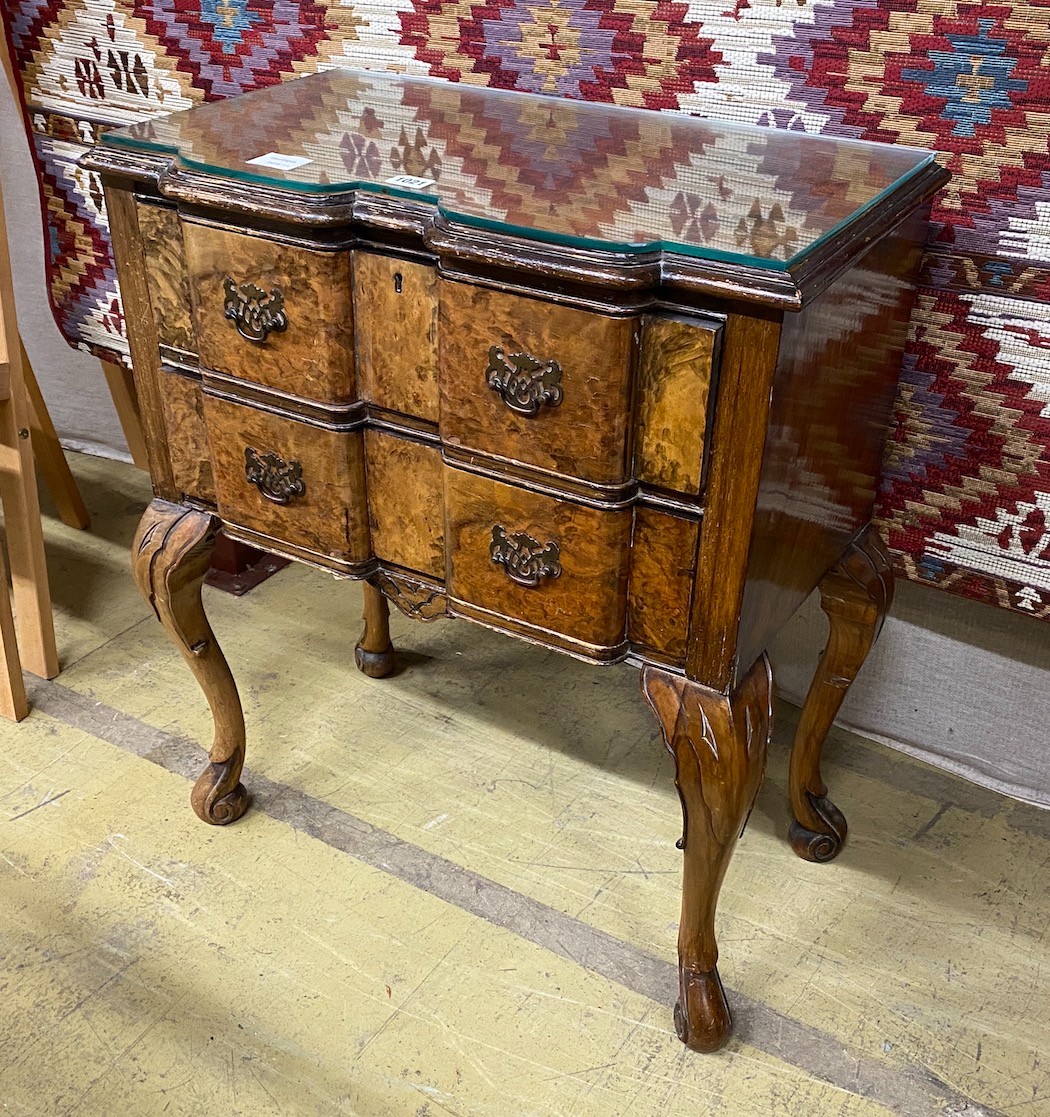 A Queen Anne revival serpentine walnut and simulated walnut two drawer side table, width 62cm, depth 36cm, height 72cm